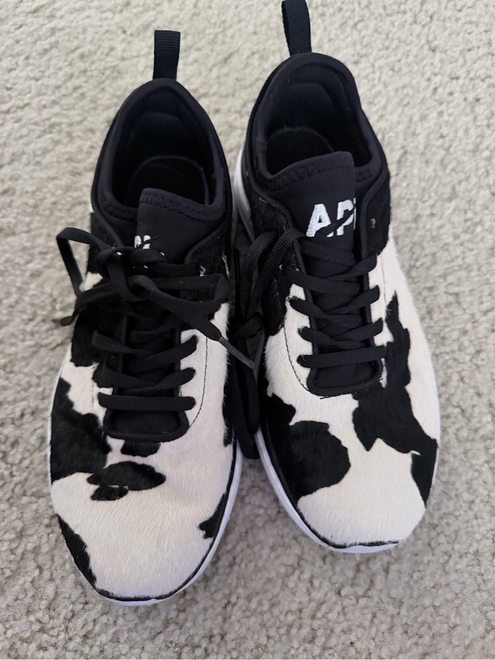 APL Women’s Unisex Black and White Cow Print TechLoom Sneakers